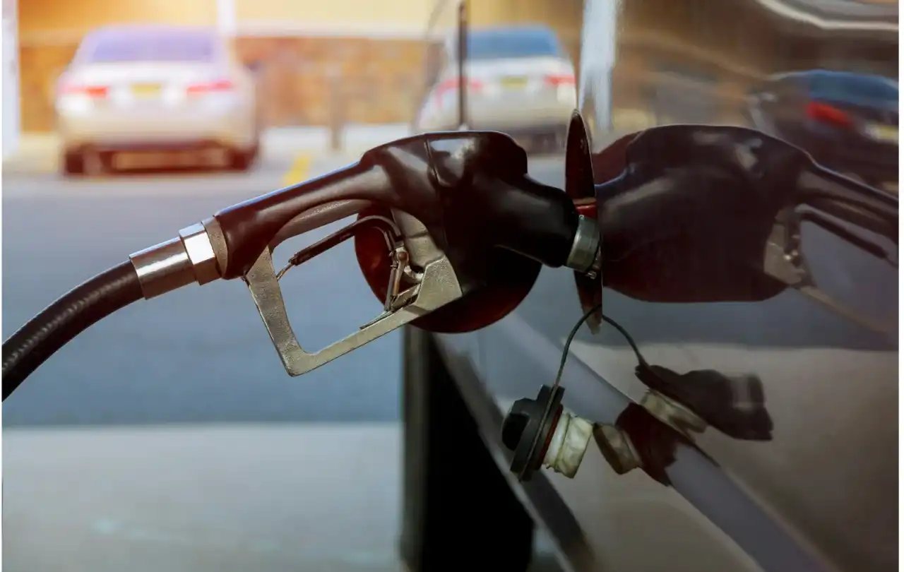 Fuel dispenser nozzle at a commercial gas station representing petroleum environments where FEP Category 5e cables support forecourt communication and monitoring systems
