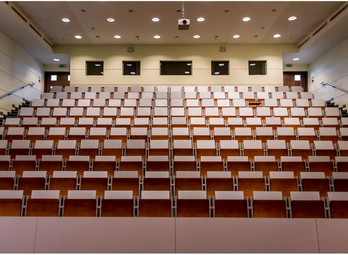 Commercial lecture hall with integrated AV system, illustrating environments where DB9 serial cables support AV control communication between devices