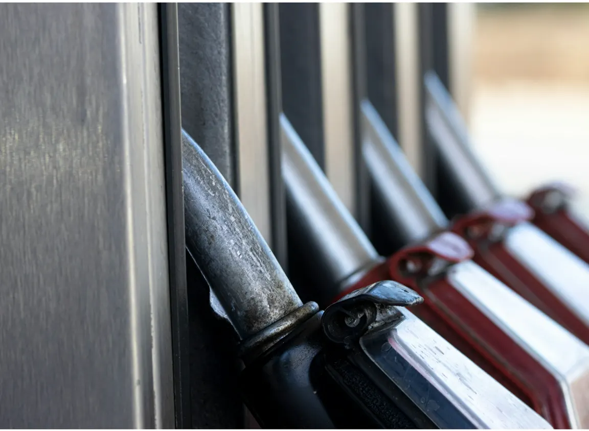 Fuel pump nozzle at gas station, illustrating petroleum environments where oil-resistant cable supports durability under chemical exposure and mechanical stress