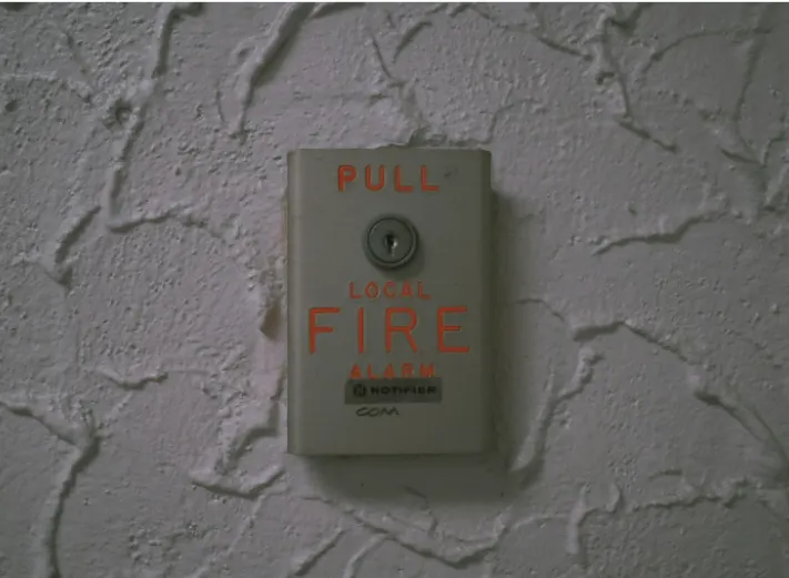 Wall-mounted fire alarm pull station used in commercial fire alarm systems illustrating life safety signaling devices connected by fire alarm cable and wiring