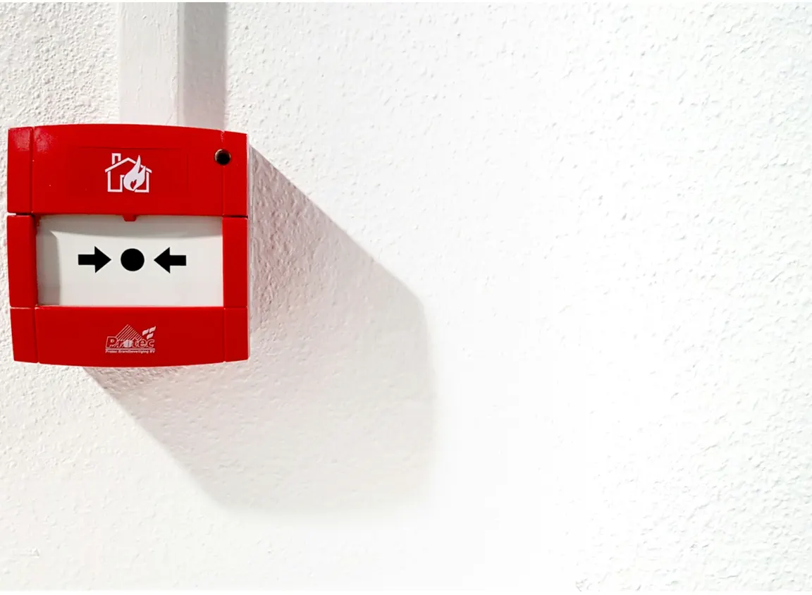 Fire alarm wall device in commercial building, illustrating life safety systems where 16 AWG fire alarm wire supports reliable signal and power distribution