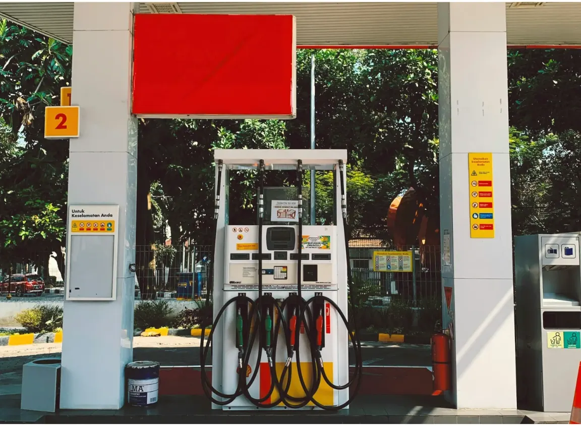 Gas station fuel dispenser connected to EMV payment, monitoring, and low-voltage communication systems in a petroleum forecourt environment